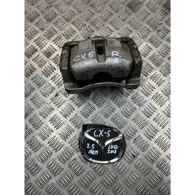 Супорт передній правий Mazda CX-5 (2012-2017) K0Y13398Z