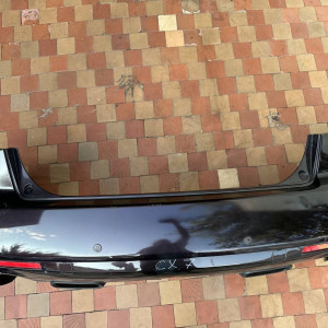 Бампер задний для Mazda CX-7 (2006-2012) EHY05022XAA